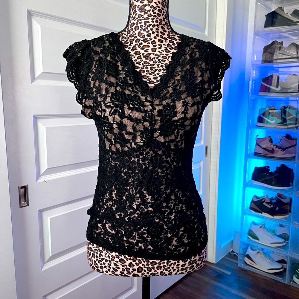 Lace shoulder length sleeved tank. See-through except for breast area